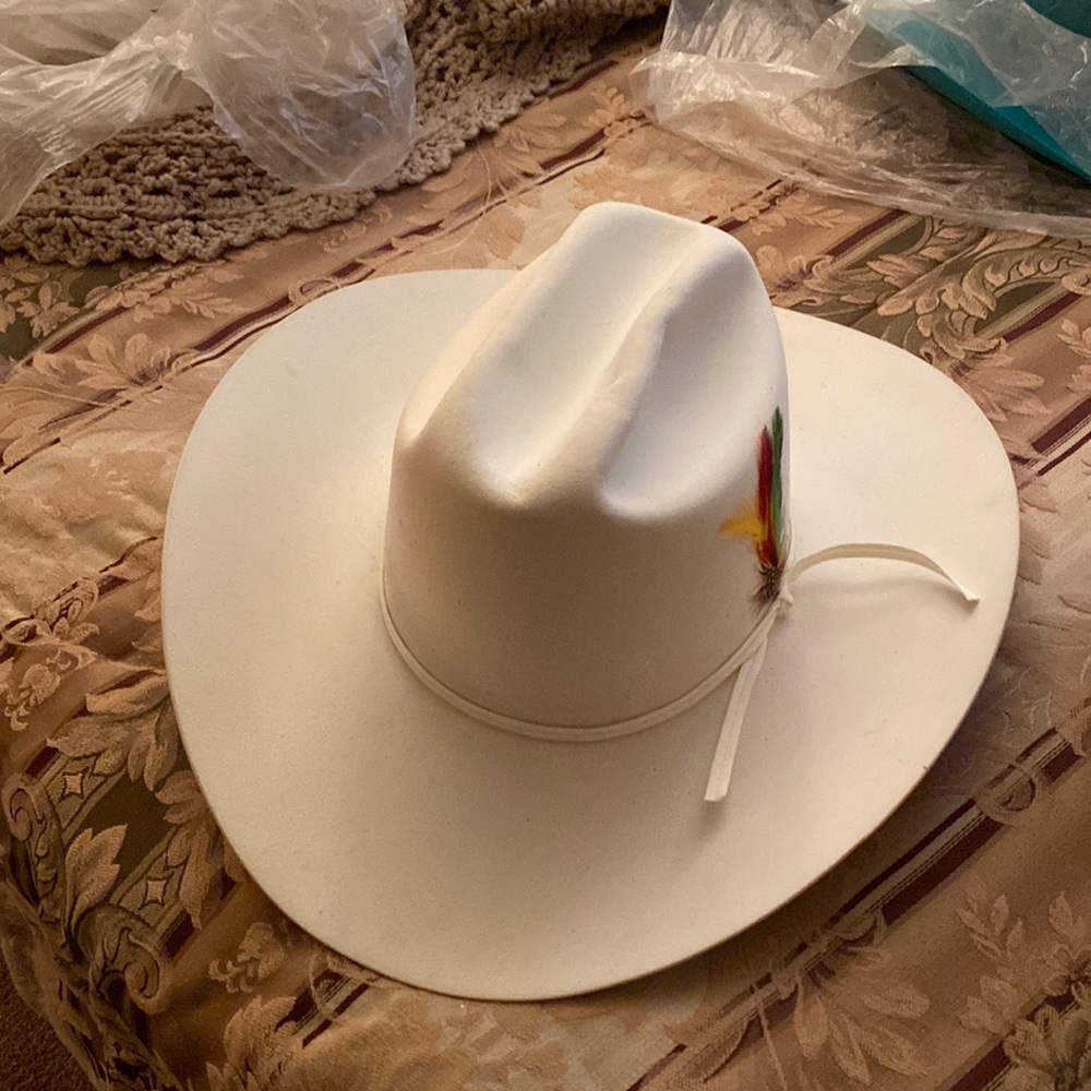 Ivory colored also another hat of Ann Miller’s